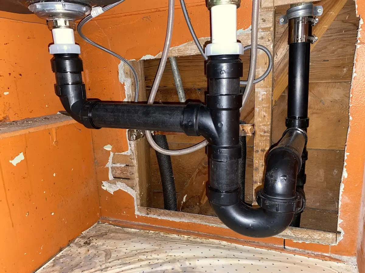 Professional Garbage Disposal Repair equipment and tools on the job in Whitefish Bay
